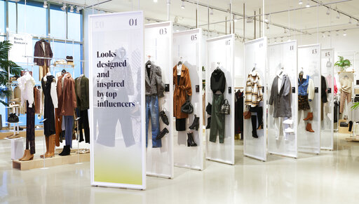 This image provided by Amazon, shows how clothing could be displayed at the company's new Amazon Style store concept. Amazon is set to open its first-ever physical clothing store later this year at the Americana at Brand mall in Glendale, Calif., that will push out personalized recommendations as customers shop and scan items on their phone and feature high-tech dressing rooms, the company announced Thursday, Jan. 20, 2021. (Greg Montijo/Amazon via AP)
