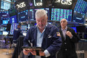 Trader Edward McCarthy, center, works on the floor of the New York Stock Exchange, Tuesday, May 5, 2026. (AP Photo/Richard Drew)