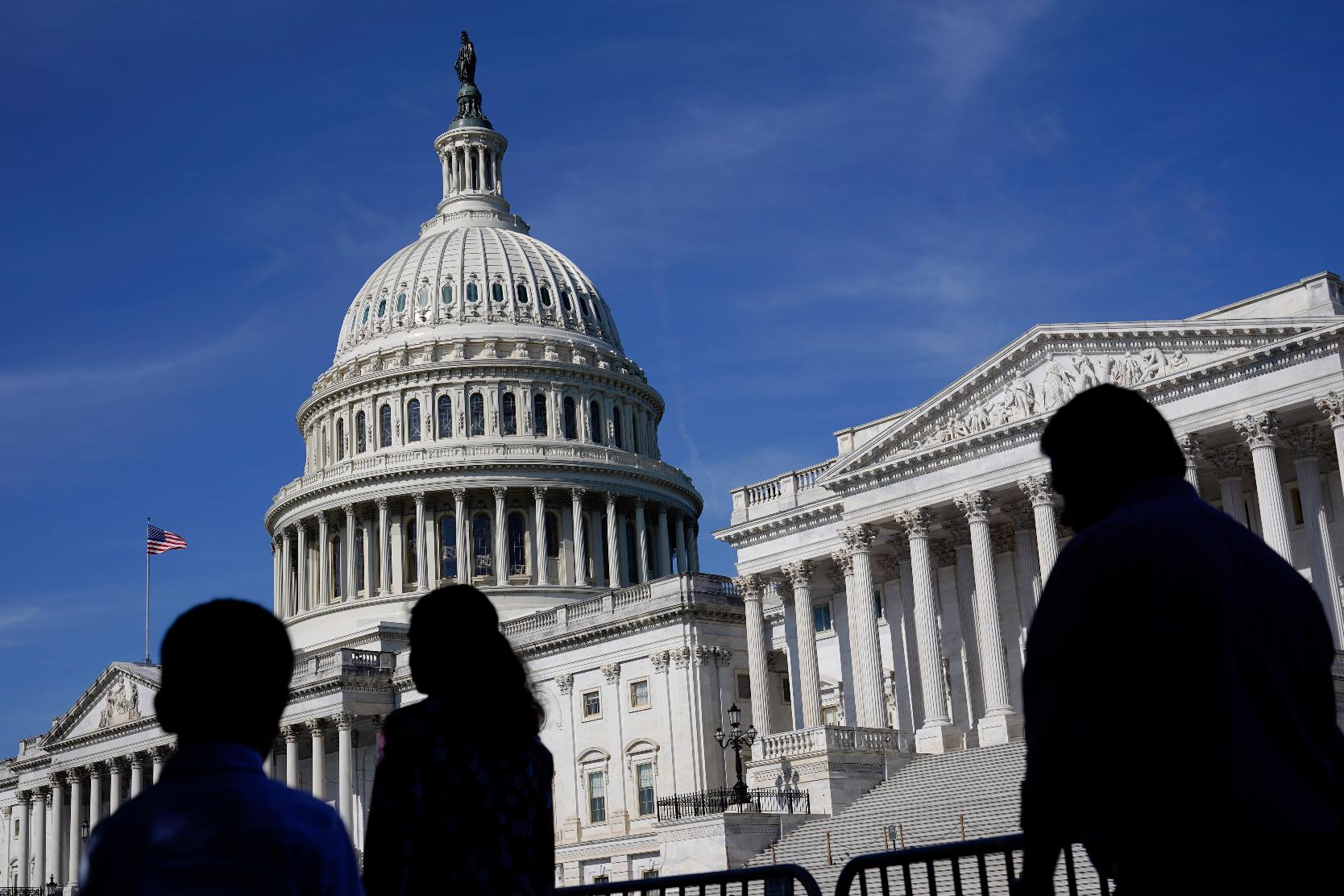 FILE - People walk outside the U.S. Capitol building in Washington on June 9, 2022. Members of the House and Senate were informed Wednesday, March 8, 2023, that hackers may have gained access to their sensitive personal data in a breach of a Washington, D.C., health insurance marketplace. (AP Photo/Patrick Semansky, File)