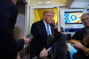 President Donald Trump speaks to reporters aboard Air Force One, Friday, May 15, 2026, as he returns from a trip to Beijing, China. (AP Photo/Mark Schiefelbein)