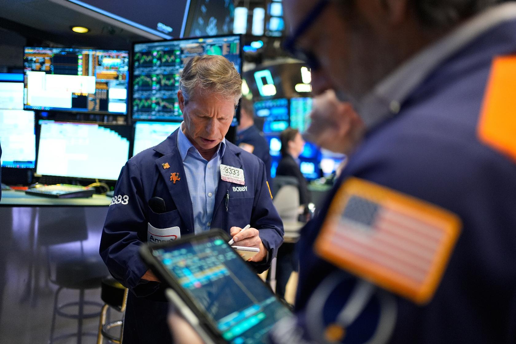 Bobby Charmak works on the floor at the New York Stock Exchange in New York, Wednesday, March 25, 2026. (AP Photo/Seth Wenig)