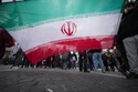 Protesters hold an Iranian flag as they take part in a national demonstration against the war in Iran and the March 22 referendum on the Italian justice system, in Rome, Saturday, March 14 2026. (AP Photo/Andrew Medichini)