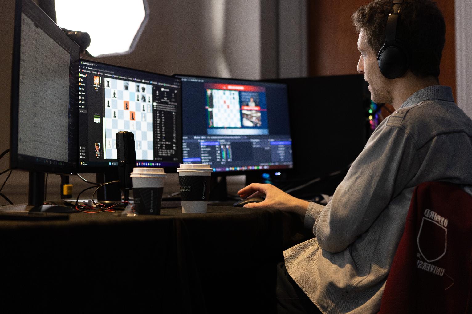 This undated photo released by Charlotte Chess Center shows Daniel Naroditsky playing chess at the computer. (Kelly Centrelli/Charlotte Chess Center via AP)