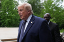 U.S. President Donald Trump walks away after a group photo of leaders at the G7 summit, Tuesday, June 16, 2026, in Evian-les-Bains, France. (AP Photo/Julia Demaree Nikhinson)