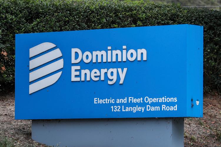 FILE - The Dominion Energy sign outside of the Electric and Fleet Operations center in the aftermath of Hurricane Helene Sunday, Sept. 29, 2024, in Aiken, S.C. (AP Photo/Artie Walker Jr., File)