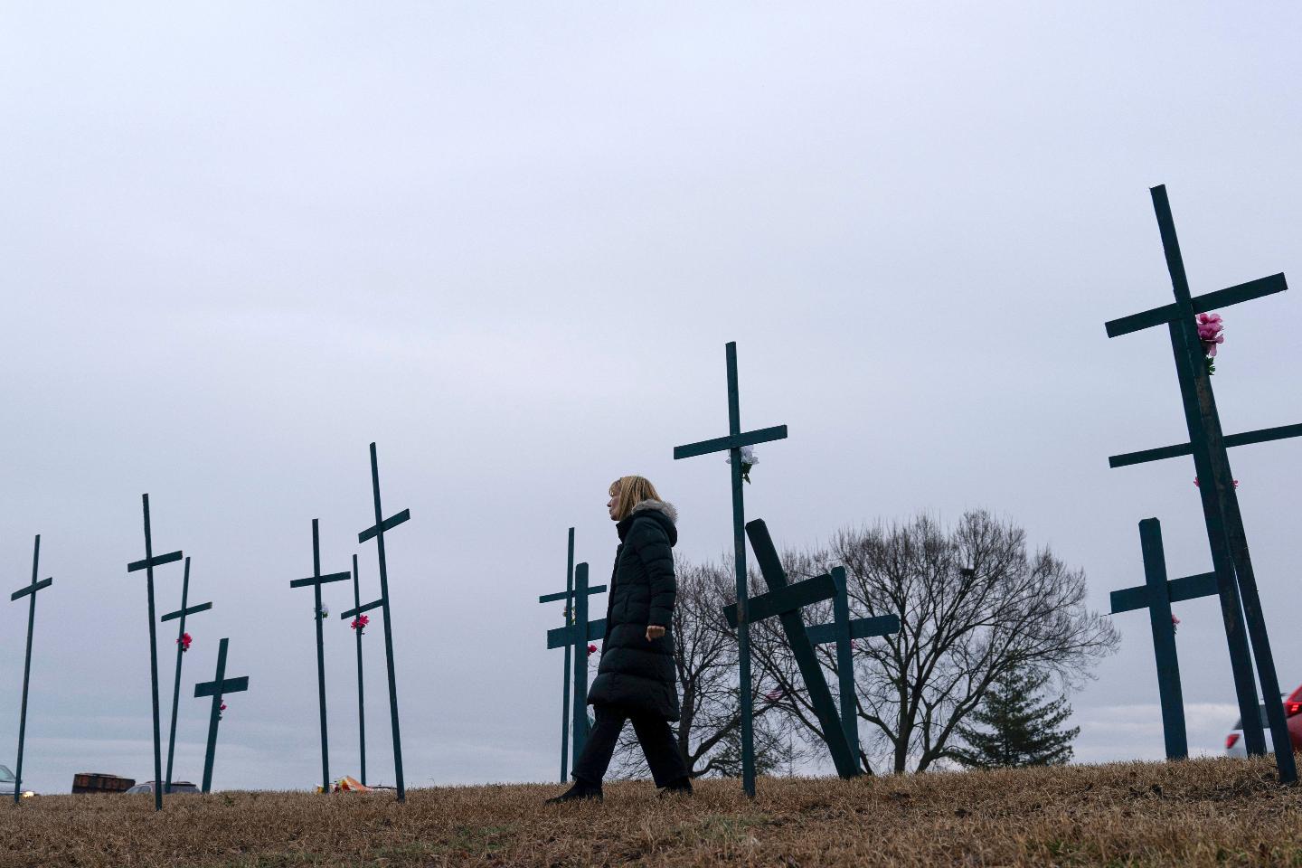 FILE - Crosses are seen at a makeshift memorial for the victims of the plane crash in the Potomac River near Ronald Reagan Washington National Airport, Friday, Jan. 31, 2025, in Arlington, Va. (AP Photo/Jose Luis Magana, file)