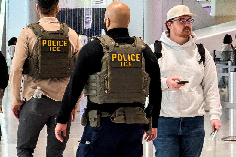 Federal immigration agents walk through Terminal A at Newark International Airport (EWR) in New Jersey, Tuesday, March 24, 2026. (AP Photo/Eduardo Munoz Alvarez)