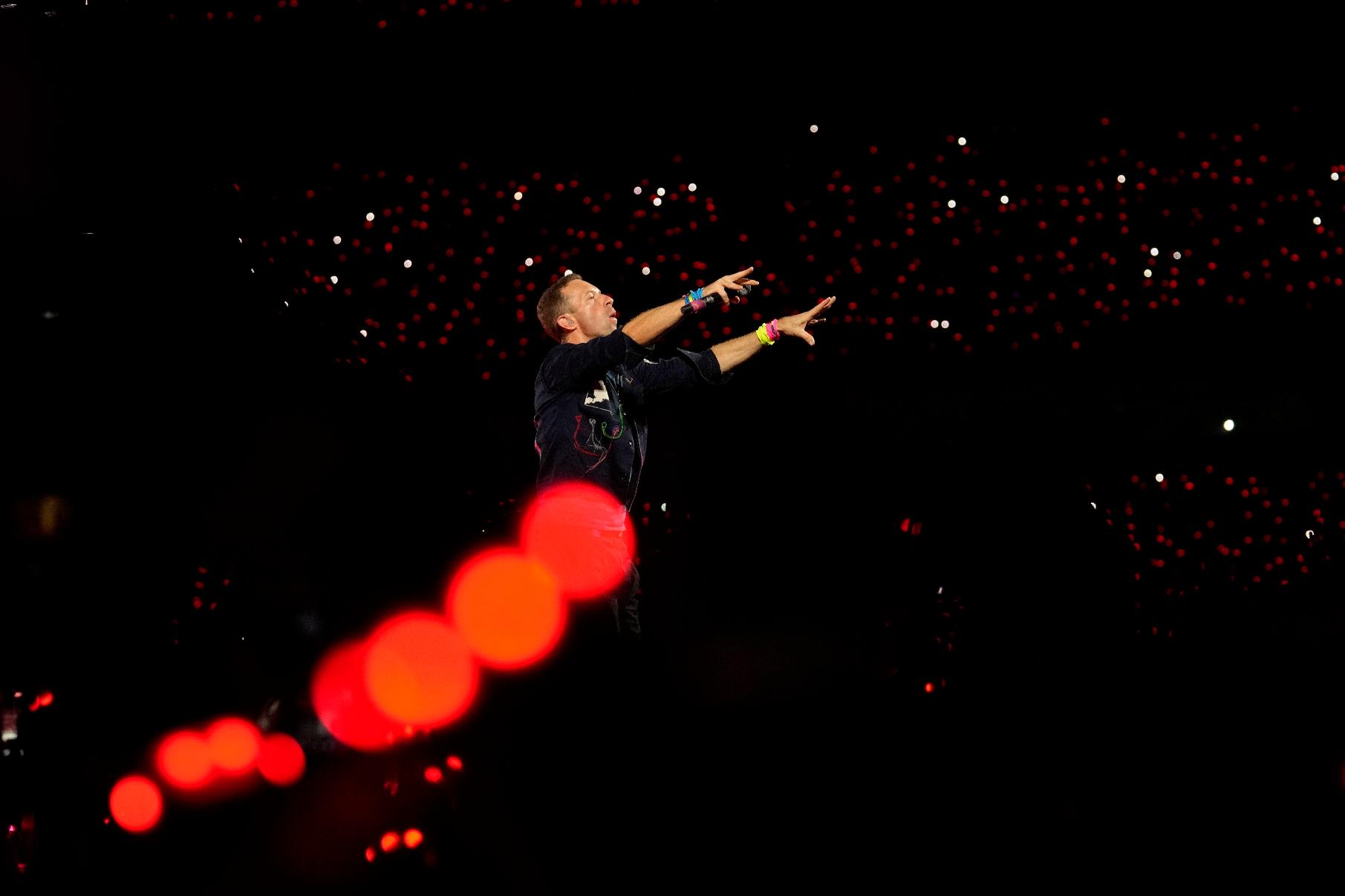 FILE - Chris Martin of Coldplay performs during the band's Music Of The Spheres World Tour at D. Y. Patil Sports Stadium in Navi Mumbai, Saturday, Jan. 18, 2025. (AP Photo/Rajanish Kakade, File)