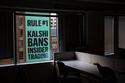 FILE - A banner for the prediction market platform Kalshi hangs from a building in Washington, Wednesday, April 1, 2026. (AP Photo/Allison Robbert, File)