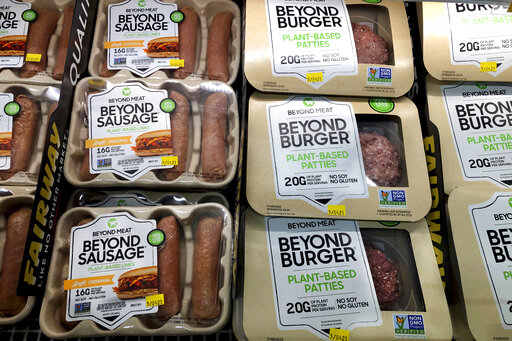 FILE - Packages of Beyond Meat's Beyond Burgers and Beyond Sausage, are shown in this photo, in New York, on April 29, 2021. The plant-based meat maker said Thursday, Aug. 4, 2022, it’s laying off 4% of its workforce after a difficult second quarter that saw cost-conscious customers bypass its higher-priced products. (AP Photo/Richard Drew, File)