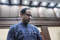 Nadiem Anwar Makarim, former Education Minister and the co-founder of Indonesia's payments platform and ride hailing company Gojek, reacts before the start of his trial hearing at the Corruption Court in Jakarta, Indonesia, Monday, April 20, 2026. (AP Photo/Achmad Ibrahim)