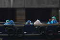 Passengers are disembarked from the hantavirus-stricken cruise ship MV Hondius at the port of Granadilla in Tenerife, Canary Islands, Spain, Sunday, May 10, 2026. (AP Photo/Manu Fernandez)