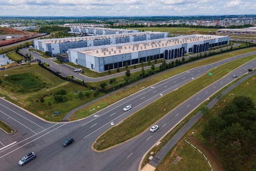 FILE - Cars drive past data centers on July 16, 2023, in Ashburn, Va. (AP Photo/Ted Shaffrey, File)