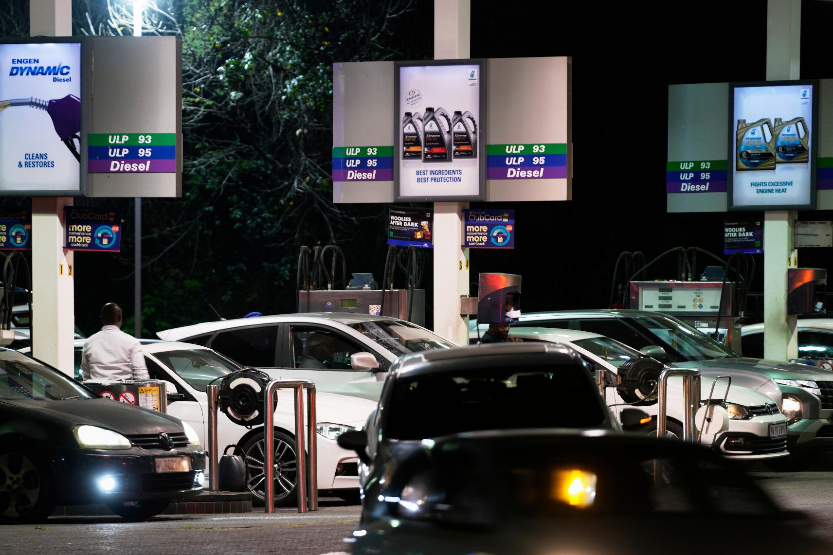 People queue to buy fuel at a petrol station, in Johannesburg, South Africa, Tuesday, March 31, 2026. (AP Photo/Themba Hadebe)