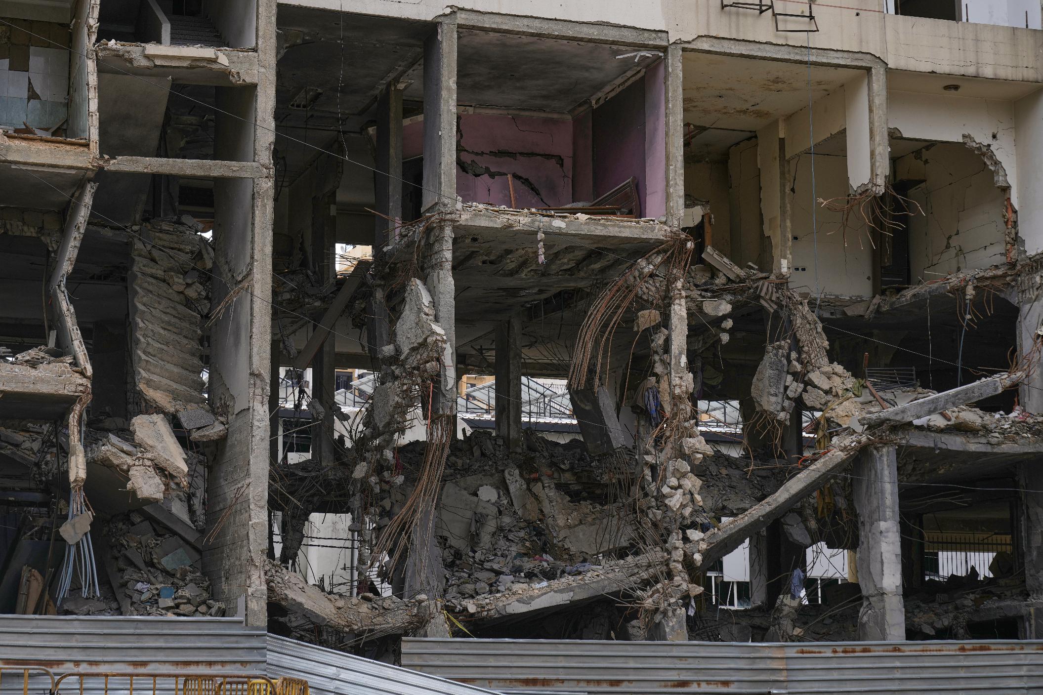 A view of a building damaged in an Israeli airstrike, in Dahiyeh, Beirut's southern suburbs, Beirut's southern suburbs, Lebanon, Monday, March 16, 2026. (AP Photo/Bilal Hussein)