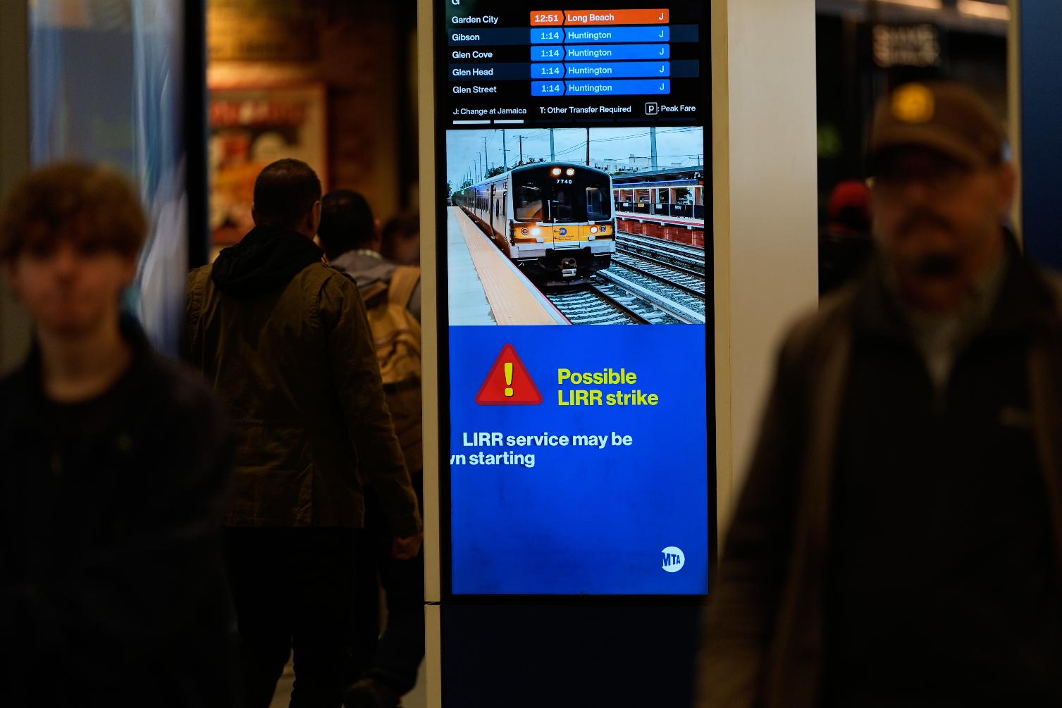 A sign warns commuters of a potential Long Island Rail Road strike at Penn Station in New York, Thursday, May 14, 2026. (AP Photo/Seth Wenig)