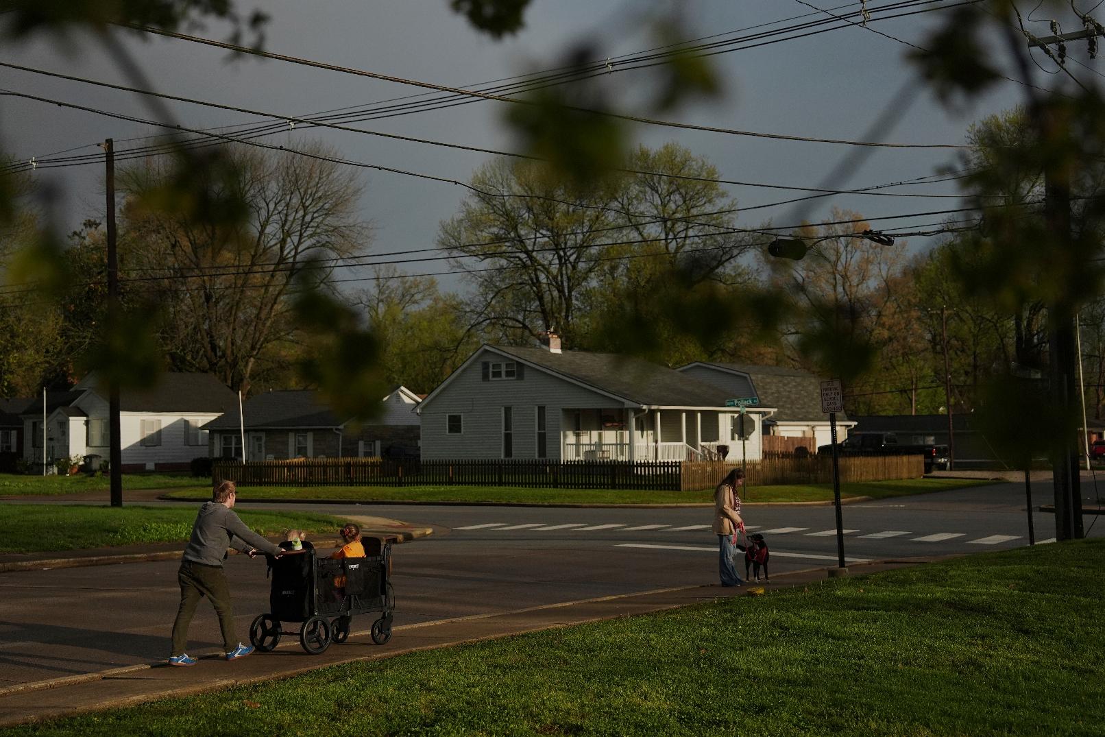 Kirt Ethridge, left, walks with his wife, Grace, right, and their daughters Thursday, April 10, 2025, in Evansville, Ind. (AP Photo/Joshua A. Bickel)
