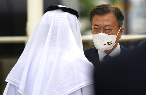 South Korean President Moon Jae-in receives by Sheikh Nahyan bin Mubarak Al Nahyan, UAE Minister of State for Tolerance during an official ceremony at the Dubai Expo 2020, in Dubai, United Arab Emirates, Sunday, Jan. 16, 2022. (AP Photo/Kamran Jebreili)
