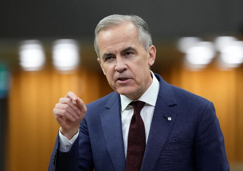 FILE - Canada Prime Minister Mark Carney rises during Question Period on Parliament Hill in Ottawa, April 15, 2026. (Adrian Wyld/The Canadian Press via AP, File)