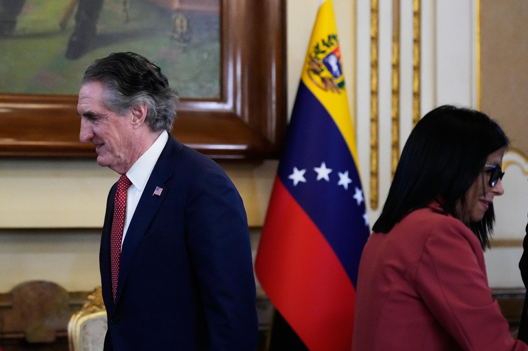 Venezuela's acting President Delcy Rodriguez, right, and U.S. Interior Secretary Doug Burgum arrive for a meeting at Miraflores presidential palace in Caracas, Venezuela, Wednesday, March 4, 2026. (AP Photo/Ariana Cubillos)