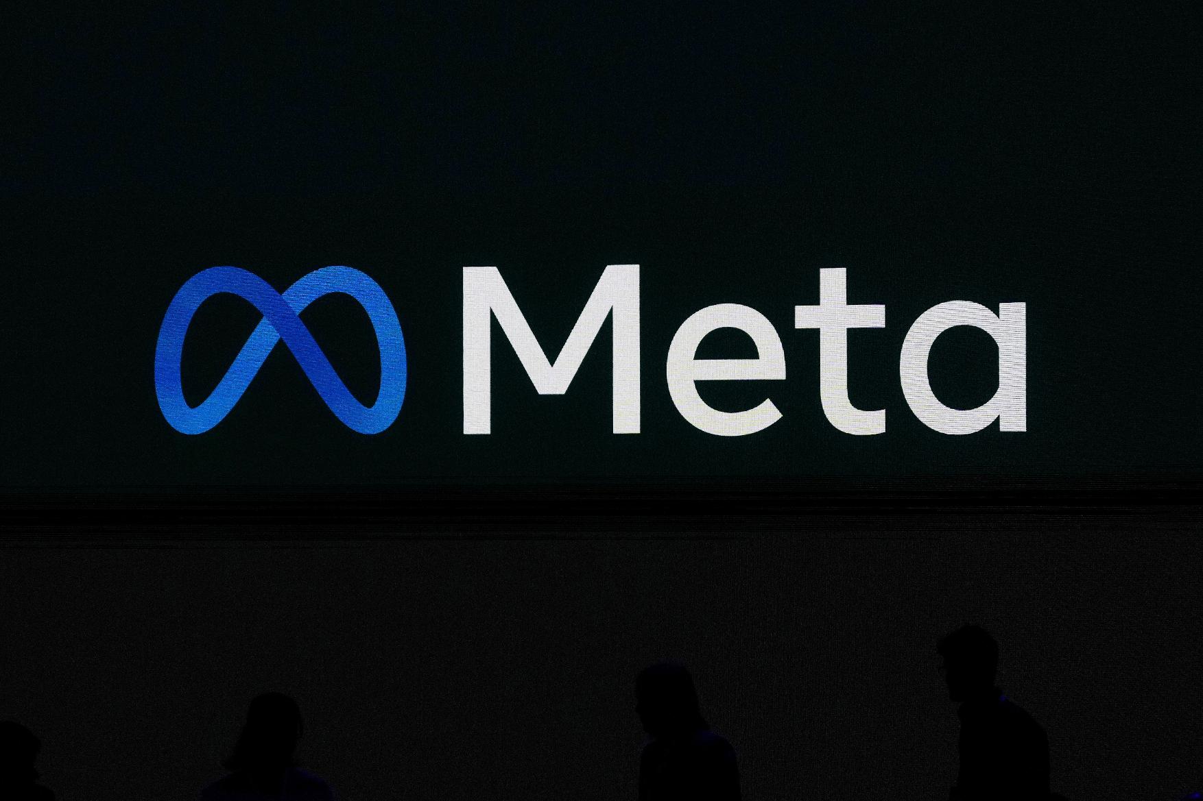 FILE - A Meta logo is shown on a video screen at LlamaCon 2025, an AI developer conference, in Menlo Park, Calif., April 29, 2025. (AP Photo/Jeff Chiu, File)