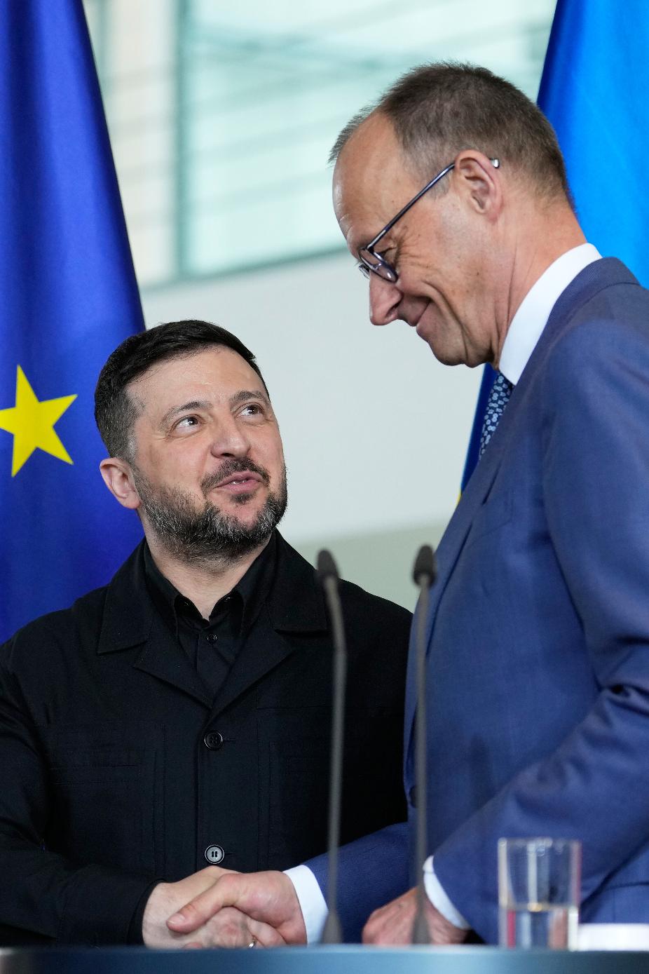 Ukraine's President Volodymyr Zelenskyy and German Chancellor Friedrich Merz attend a press conference at the German-Ukrainian government consultations in Berlin Germany, Tuesday, April 14, 2026. (AP Photo/Ebrahim Noroozi)