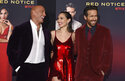 From left, cast members Dwayne Johnson, Gal Gadot and Ryan Reynolds arrive at the Los Angeles premiere of "Red Notice" at L.A. Live on Wednesday, Nov. 3, 2021. (Photo by Jordan Strauss/Invision/AP)