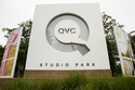 FILE - Corporate signage is shown outside a QVC facility in West Chester, Pa., Friday, July 7, 2017. (AP Photo/Matt Rourke, File)