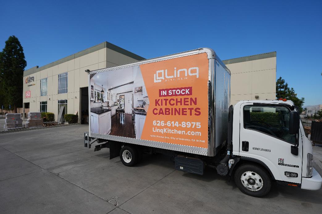 A truck stands outside a show room and warehouse belonging to Linq Kitchen, a designer and maker of kitchen cabinets in City of Industry, Calif., Friday, Oct. 10, 2025. (AP Photo/Damian Dovarganes)