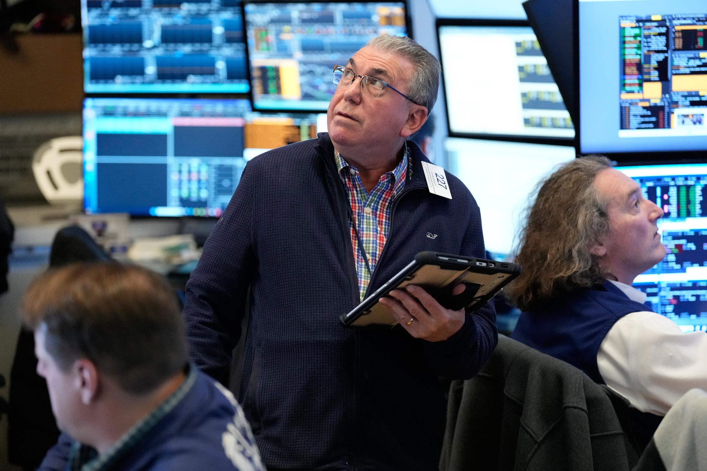 John Bishop works on the floor at the New York Stock Exchange in New York, Wednesday, March 4, 2026. (AP Photo/Seth Wenig)