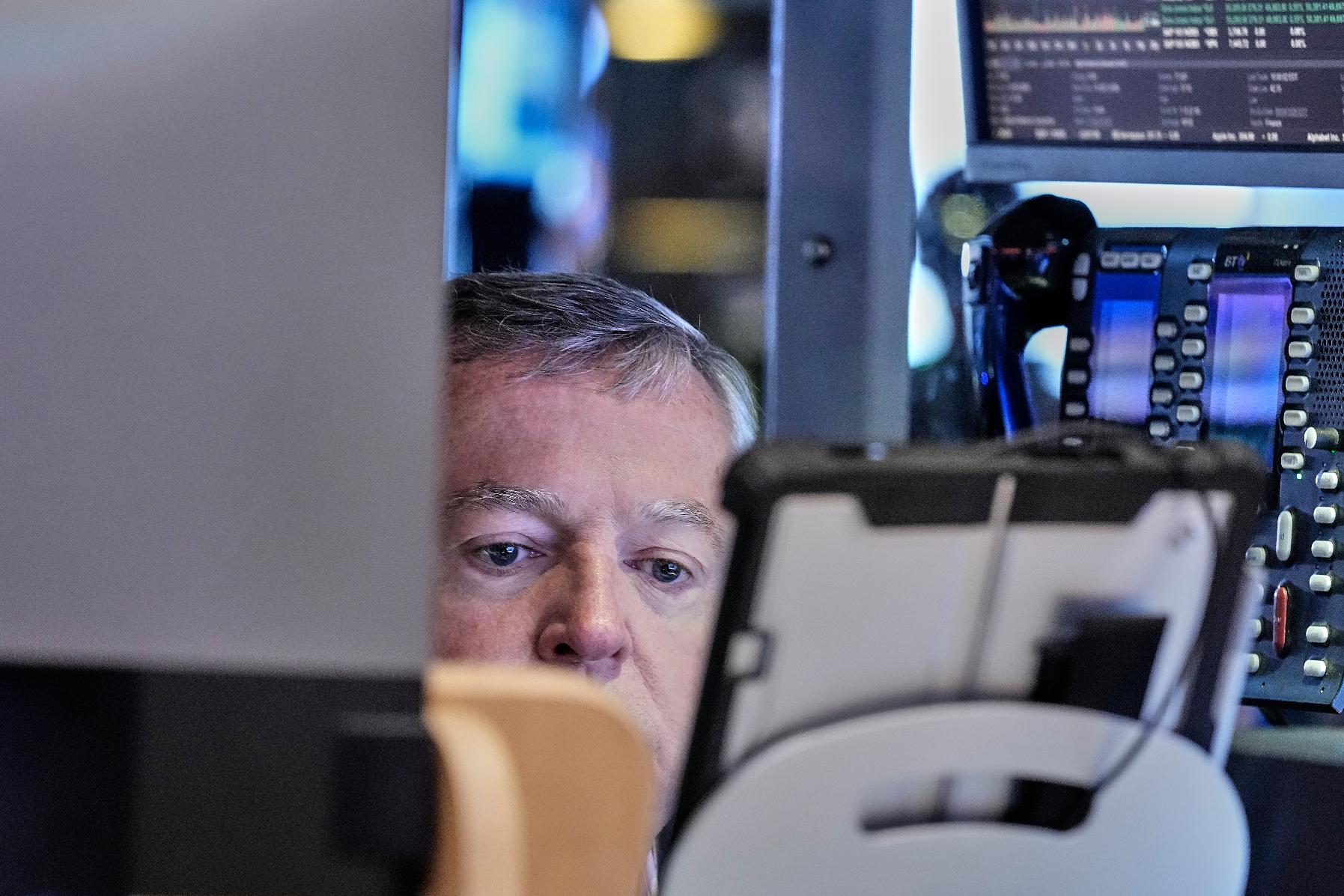 Trader James Lamb works on the floor of the New York Stock Exchange, Friday, May 22, 2026. (AP Photo/Richard Drew)
