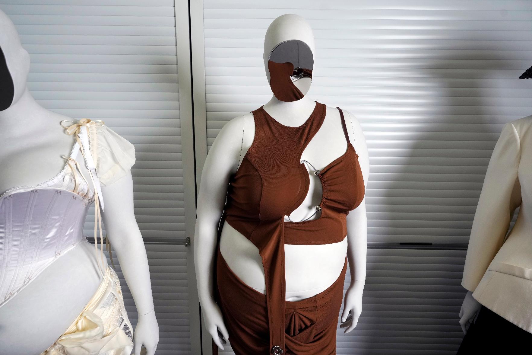 An ensemble by designer Karoline Vitto, on a mannequin model of Charlie Reynolds, center, is displayed in a room at the Metropolitan Museum of Art during preparations for the Met Gala exhibit "Costume Art" on Tuesday, April 14, 2026, in New York. (Photo by Charles Sykes/Invision/AP)