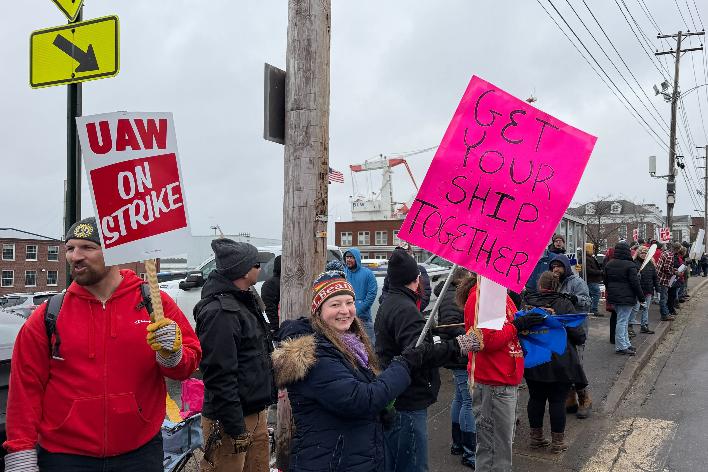 Strikers picketing outside Bath Iron Works in Bath, Maine, on Monday, May 23, 2026. (AP Photo/Rodrique Ngowi)