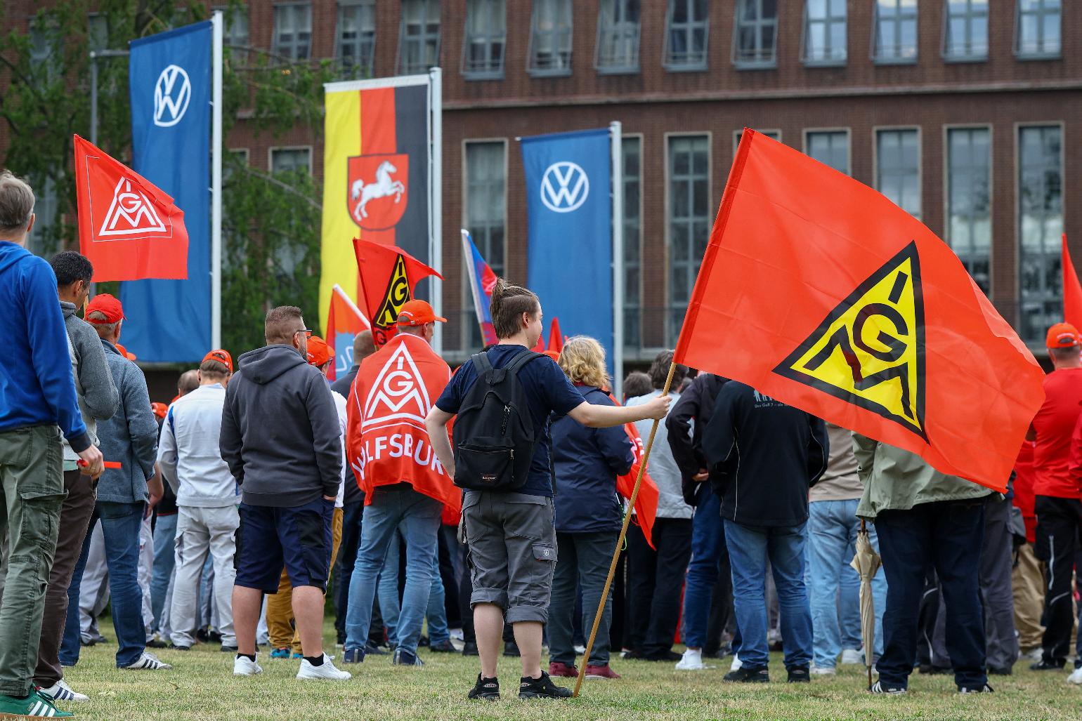 Employees of carmaker Volkswagen AG and IG Metall union members rally on the grounds of the Volkswagen headquarters on the day of the supervisory board meeting, in Wolfsburg, Germany, Thursday, July 9, 2026. (Lisi Niesner/Pool Photo via AP)