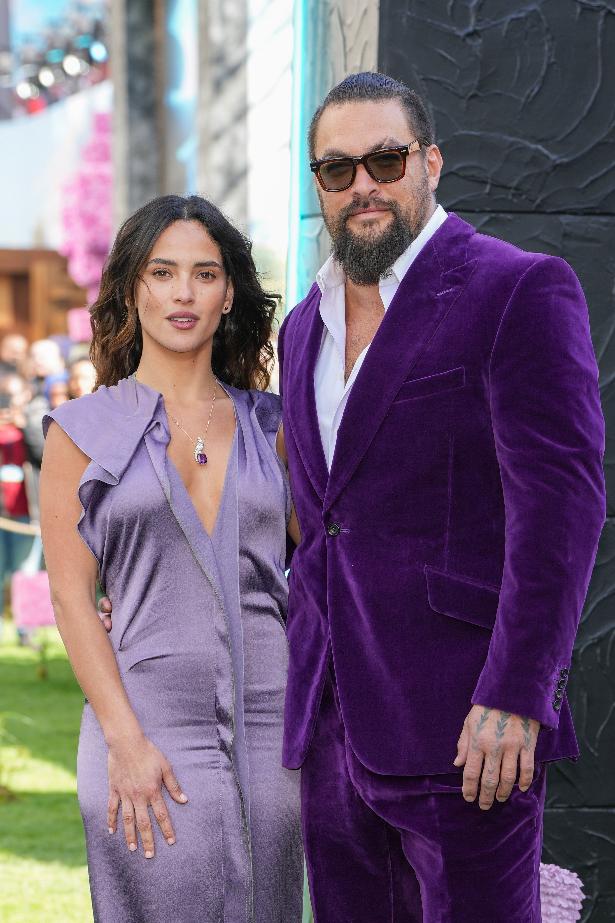 Jason Momoa, right and Adria Arjona pose for photographers upon arrival at the World premiere of A Minecraft Movie on Sunday, March 30, 2025, in London. (Photo by Scott A Garfitt/Invision/AP)