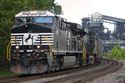 FILE - A Norfolk Southern freight train rolls past the U.S. Steel's Clairton Coke Works, in Clairton, Pa., Tuesday, Aug. 12, 2025. (AP Photo/Gene J. Puskar, File)