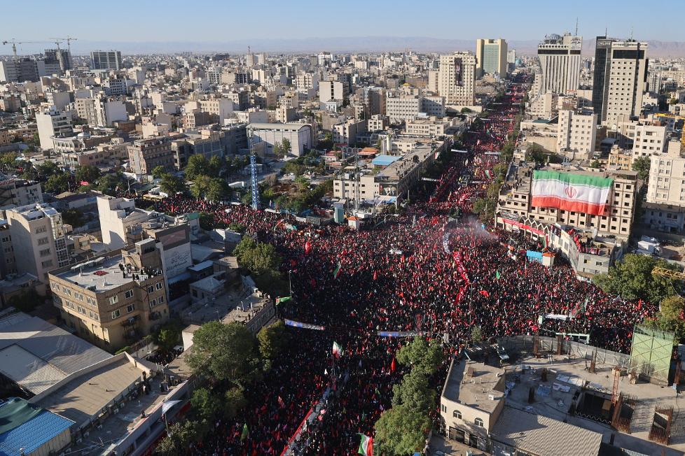 Thousands of mourners fill a square and adjoining avenues, stretching for blocks, during the final stage of funeral ceremonies for the late Iranian Supreme Leader Ayatollah Ali Khamenei and members of his family in Mashhad, northeastern Iran, Thursday, July 9, 2026. (Mohammad Hasan Salavati/Shahraranews via AP)
