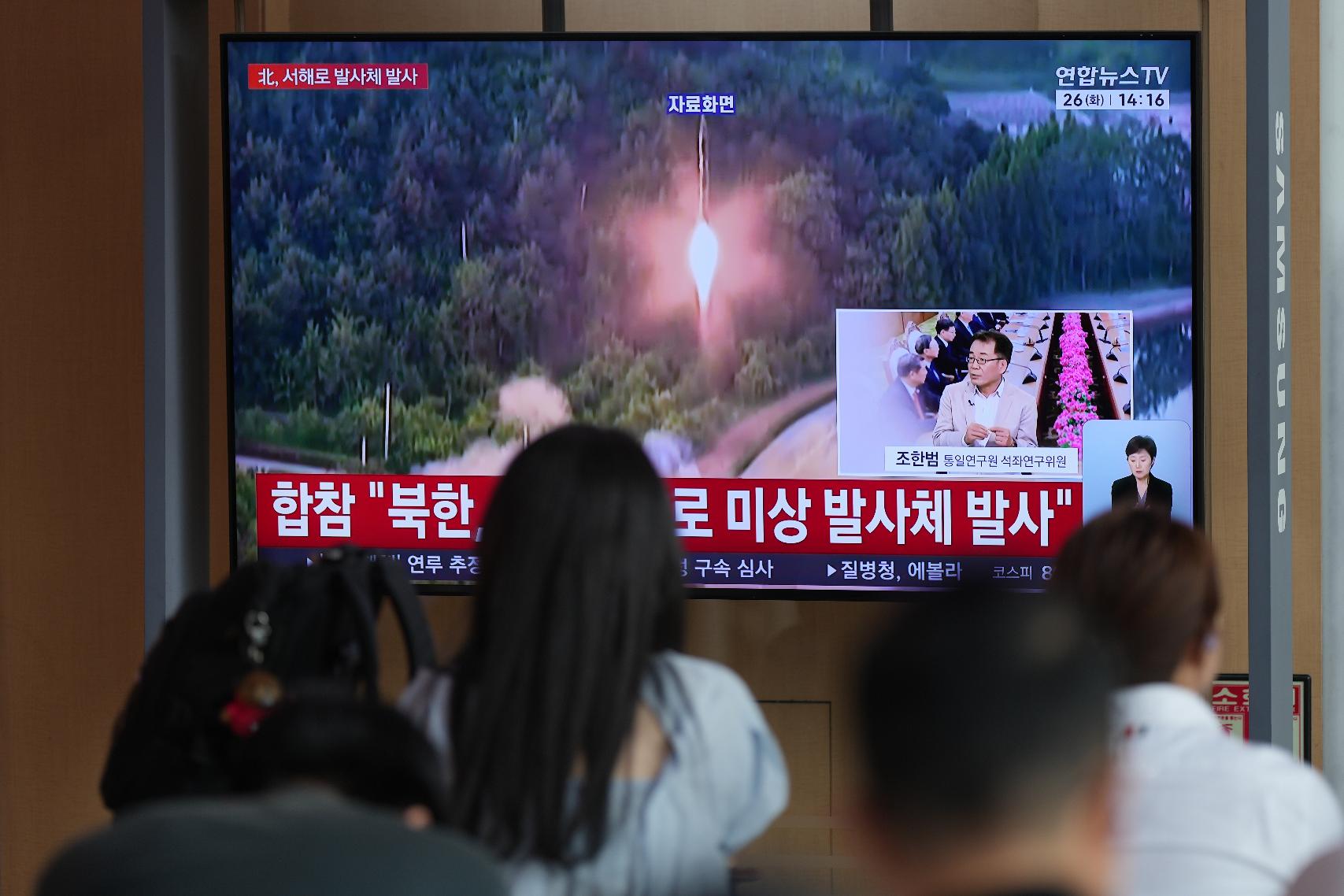 A TV screen shows a reporting of North Korea's unidentified projectile, with file footage during a news program at the Seoul Railway Station in Seoul, South Korea, Tuesday, May 26, 2026. (AP Photo/Lee Jin-man)