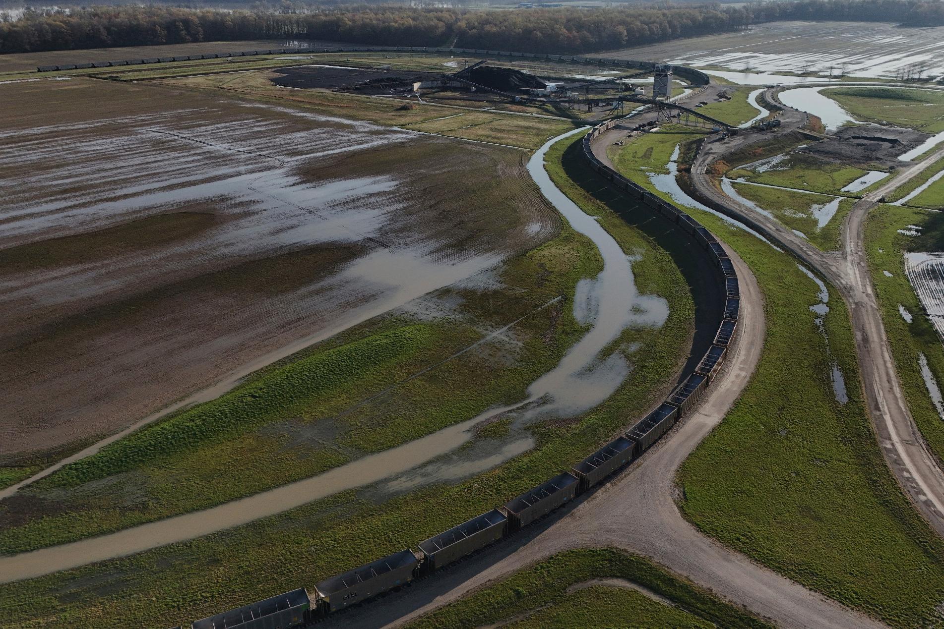 FILE - A train sits near a coal pile, April 10, 2025, in Princeton, Ind. (AP Photo/Joshua A. Bickel, File)