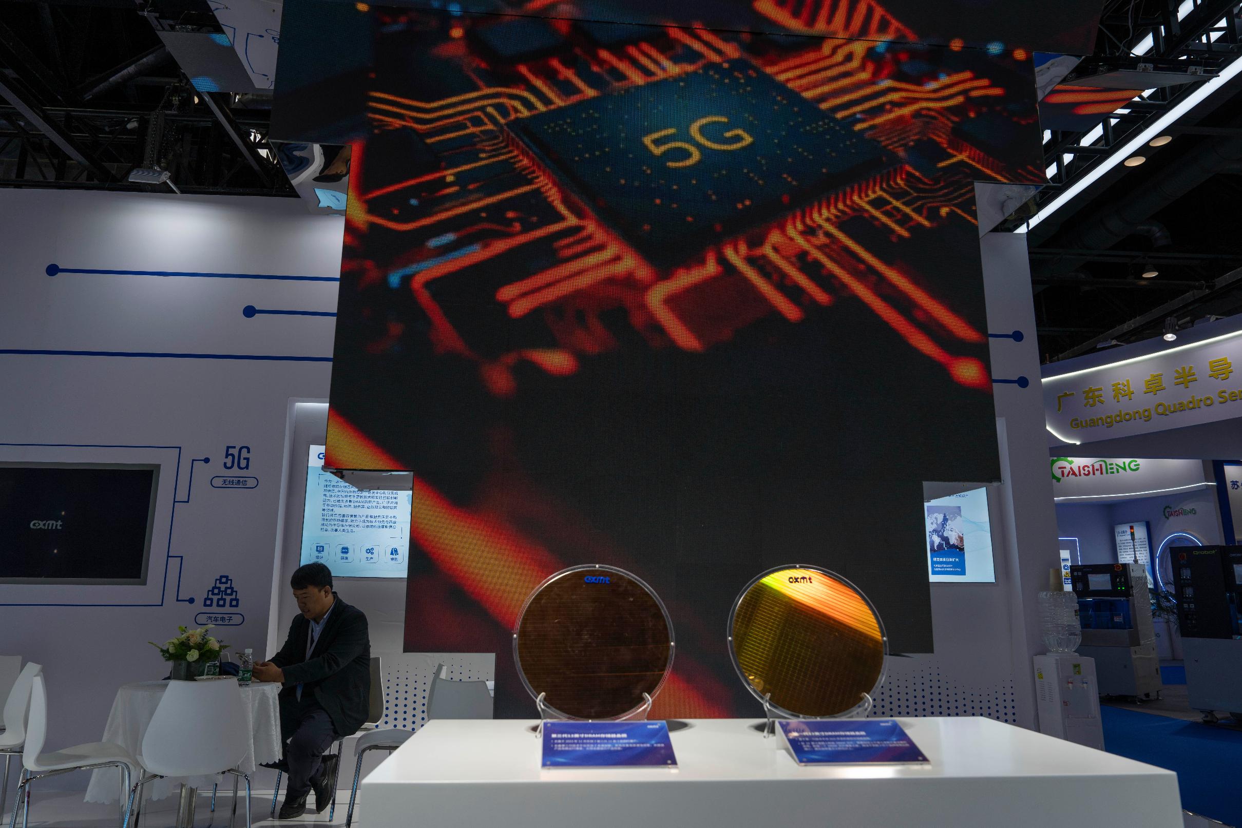 FILE - A man rests at the booth for Chinese DRAM producer ChangXin Memory Technologies, also known as CXMT, during the 21st China International Semiconductor Expo in Beijing, Nov. 20, 2024. (AP Photo/Ng Han Guan, File)