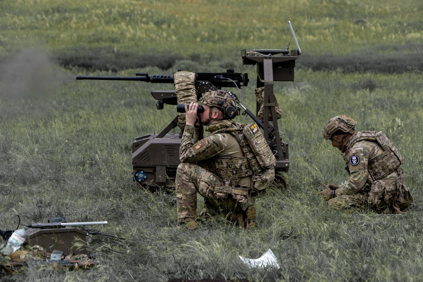 Ukrainian servicemen of the Cerberus Ground Unmanned Systems Company of the 60th Separate Mechanized Brigade, Third Army Corps, conduct a drill with a combat ground drone during a training at the polygon in Kharkiv region, Ukraine, Sunday, May 24, 2026. (AP Photo/Andrii Marienko)