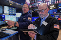 Specialist Anthony Matesic, left, and trader Fred Demarco work on the floor of the New York Stock Exchange, Friday, May 22, 2026. (AP Photo/Richard Drew)