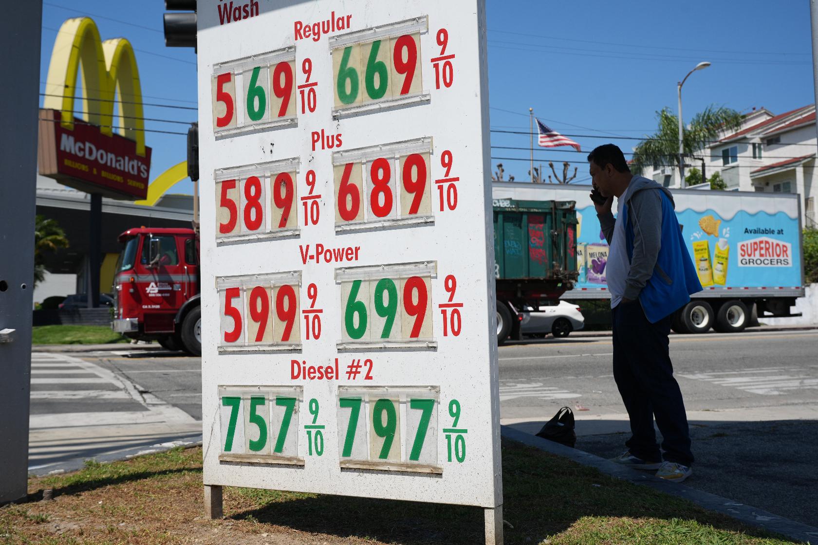 Gas prices are displayed at a gasoline station, Tuesday, April 7, 2026, in Los Angeles. (AP Photo/Damian Dovarganes)