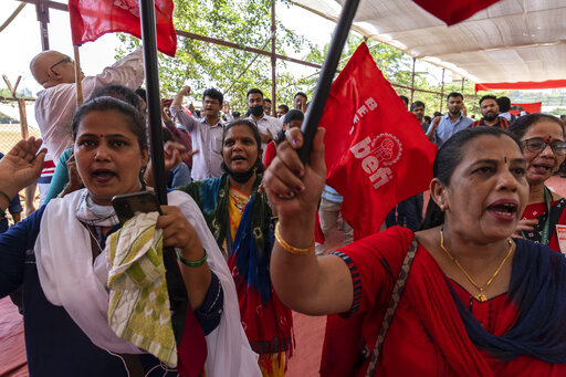 Bank employees shout slogans on the first day of a two-day nationwide strike in Mumbai, India, Monday, March 28, 2022. (AP Photo/Rafiq Maqbool)