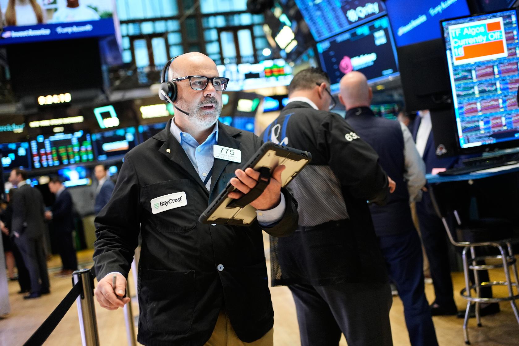Federico DeMarco works on the floor at the New York Stock Exchange in New York, Wednesday, March 25, 2026. (AP Photo/Seth Wenig)