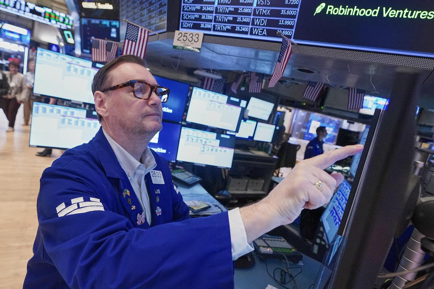 Specialist Patrick King works at his post on the floor of the New York Stock Exchange, Friday, May 1, 2026. (AP Photo/Richard Drew)