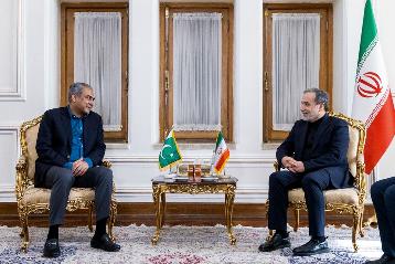 In this photo, released by the Iranian Foreign Ministry, Foreign Minister Abbas Araghchi, right, meets Pakistan's Interior Minister Mohsin Naqvi, in Tehran, Iran, Saturday, June 20, 2026. (Iran's Foreign Ministry, via AP)