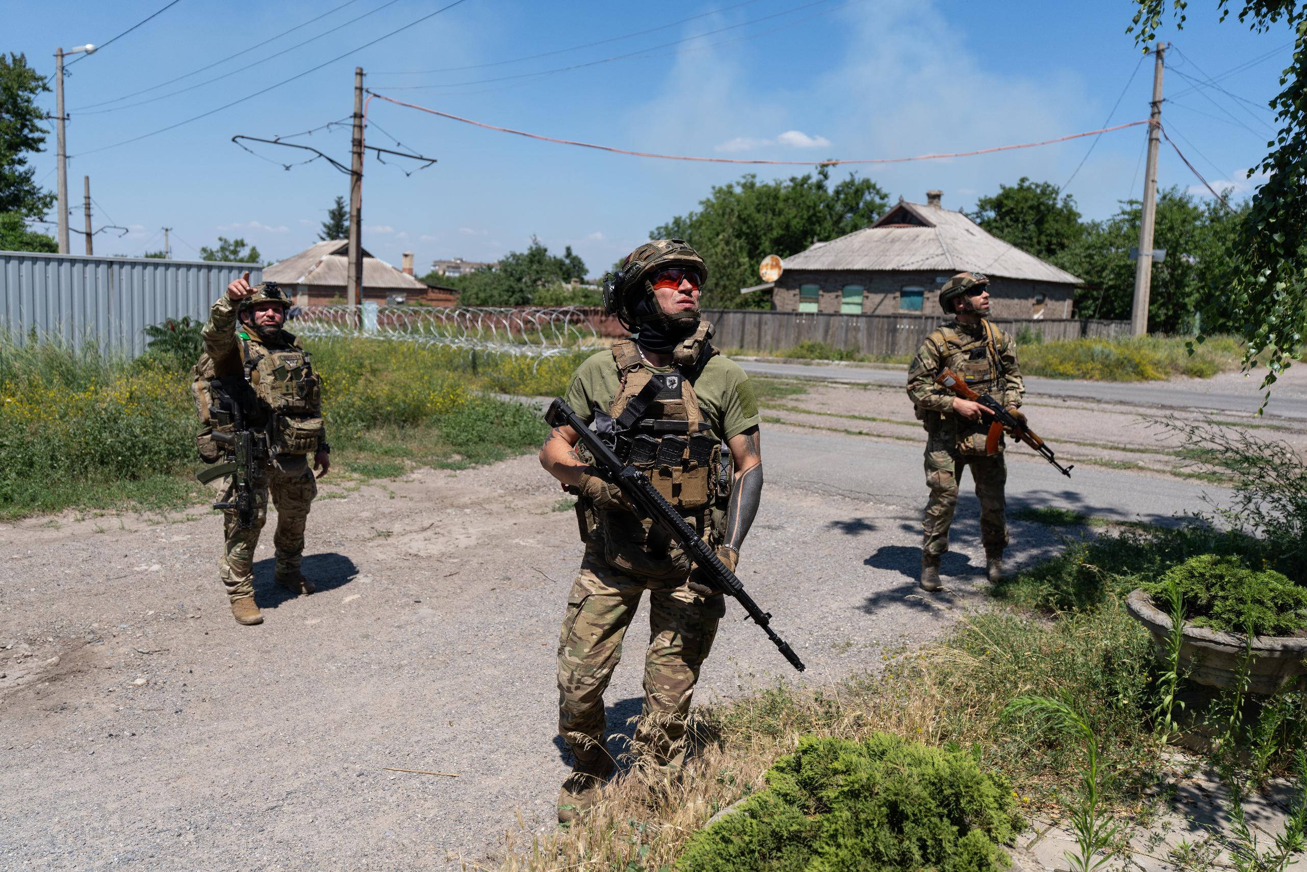 In this photo provided by Ukraine's 93rd Kholodnyi Yar Separate Mechanized Brigade press service, Soldiers of the Alcatraz batalion, patrol the frontline city Druzhkovka, Donetsk region, Ukraine, Thursday, July 2, 2026. (Iryna Rybakova/Ukraine's 93rd Mechanized Brigade via AP)