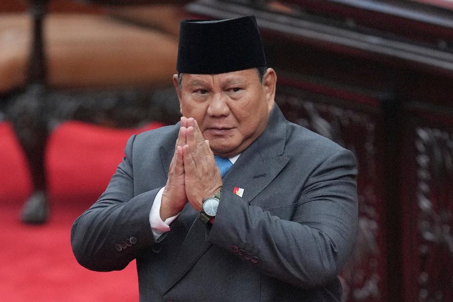 Indonesia's President Prabowo Subianto gestures before delivering his address during a House of Representatives plenary session in Jakarta, Indonesia, Wednesday, May 20, 2026. (AP Photo/Achmad Ibrahim)