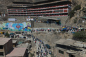 Voters line up outside a polling station during general elections in Lima, Peru, Sunday, April 12, 2026. (AP Photo/Guadalupe Pardo)
